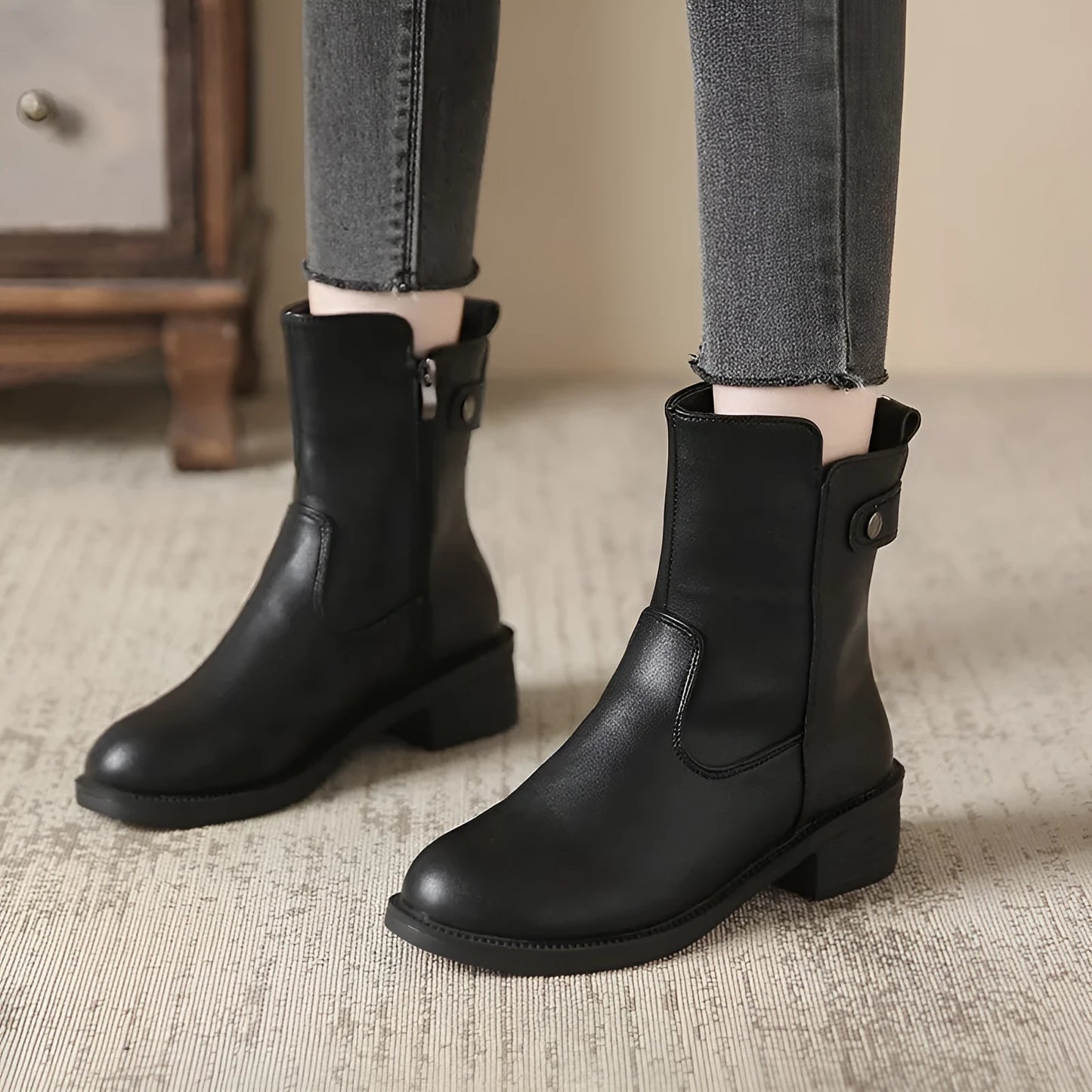 Black women's low heel boots with side zip and round toe design