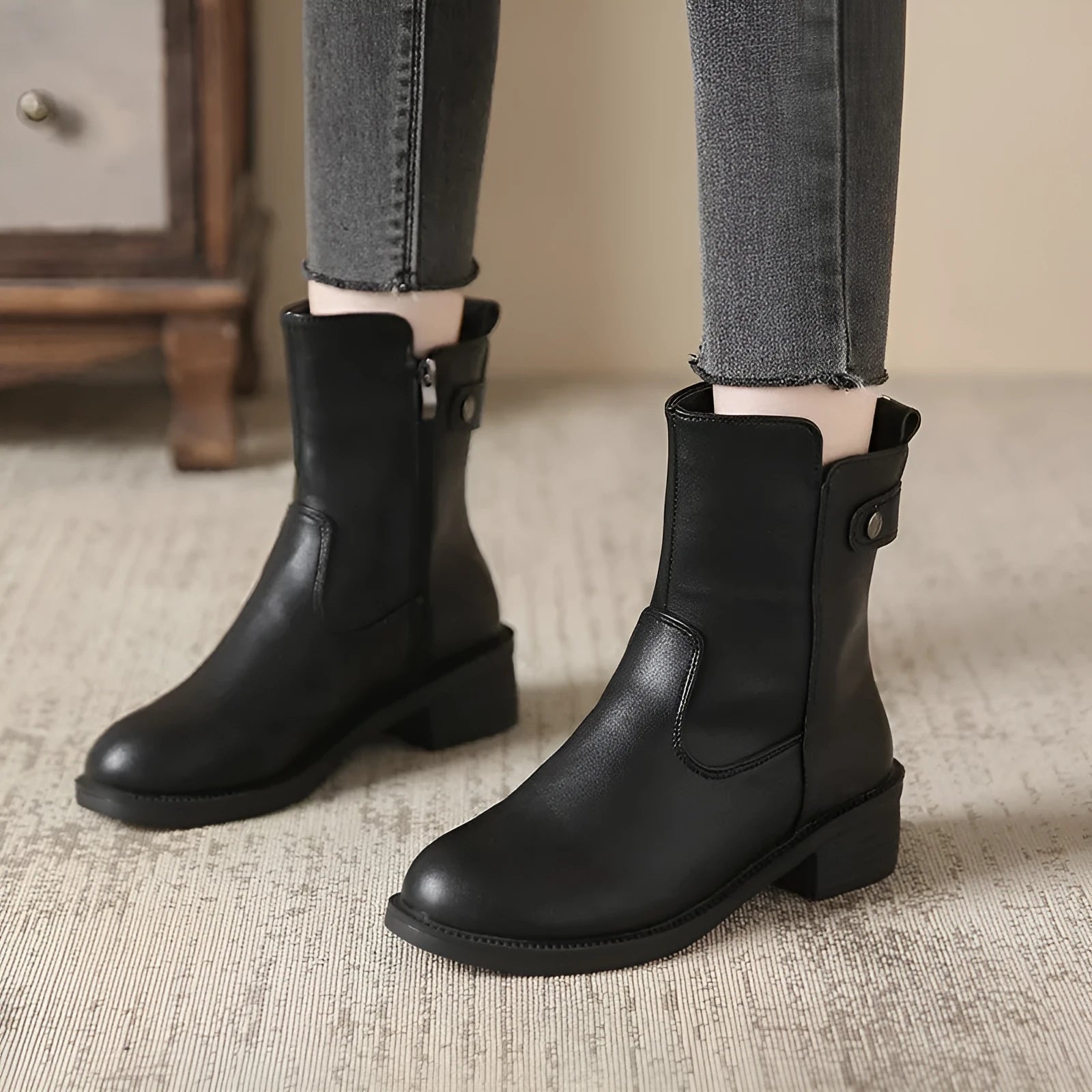 Black women's low heel boots with side zip and round toe design