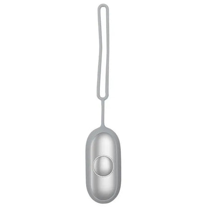 Hand-held micro-current sleep aid device in grey, green, or orange with round button and USB charging port