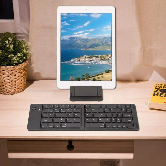 Compact, foldable Bluetooth wireless keyboard with a sleek, minimalist design for use with UK mobile devices