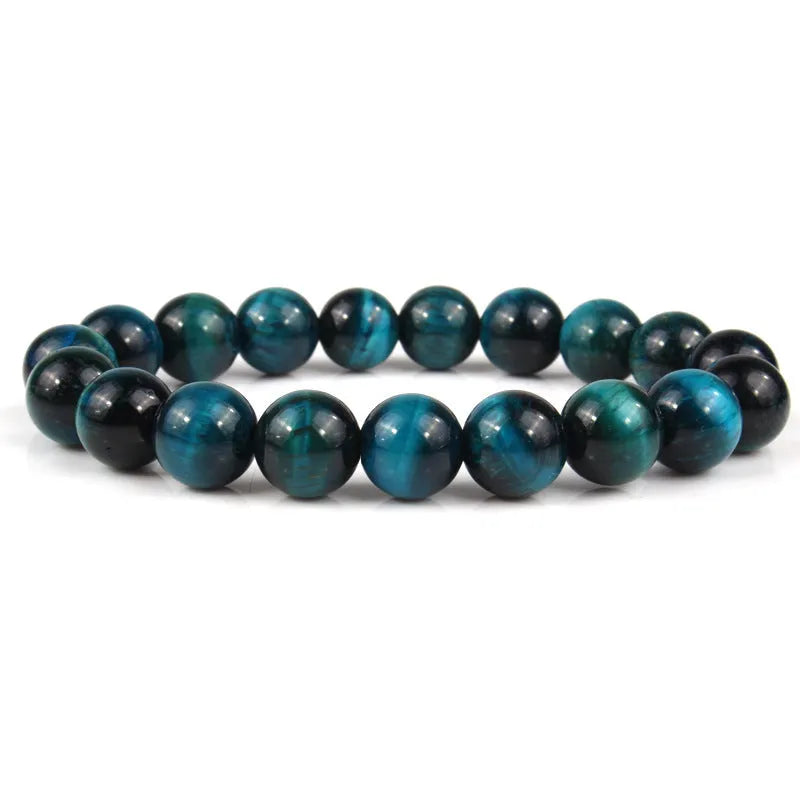 Natural tiger eye crystal bead bracelet showing round geometric beads on a wrist, available in multiple sizes and colour variations.