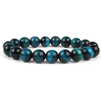 Natural tiger eye crystal bead bracelet showing round geometric beads on a wrist, available in multiple sizes and colour variations.