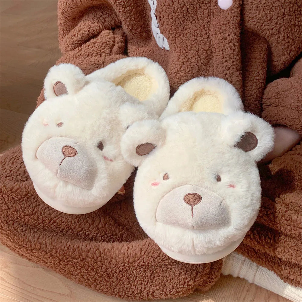 Women's cartoon-patterned suede plush slippers in milky white, shown with a rounded toe.