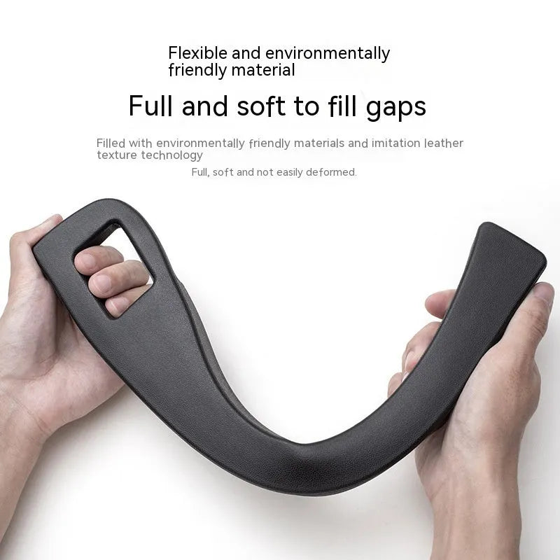 Black car seat gap storage box organiser with compartments and carrying handle between vehicle seats