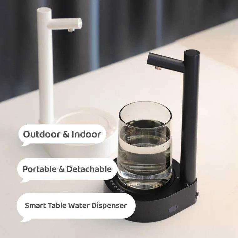 White electric water dispenser pump with USB cable for 5-gallon water bottles on desk
