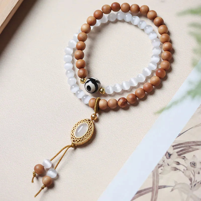 Sandalwood double ring and Opal Tibetan bead bracelet with polished finish