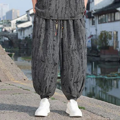 Men's thin knit two-piece suit with half-sleeve top and cropped trousers in black or grey colour options