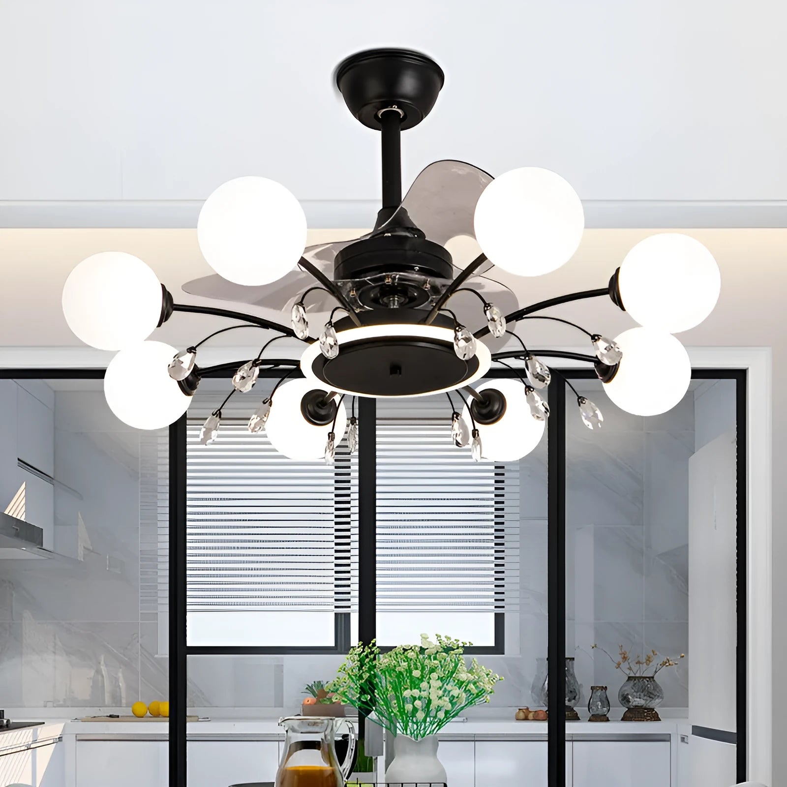 Black and gold ceiling fan lamp with acrylic shade and metal blades, shown with remote control.