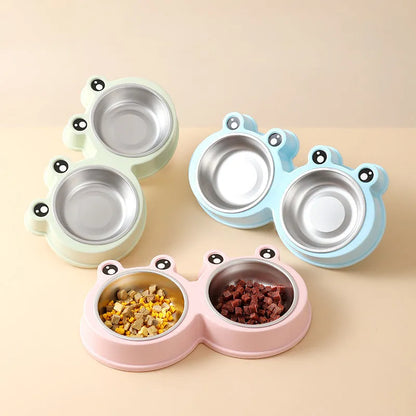 Stainless steel pet bowl with frog design and two compartments for food and water.