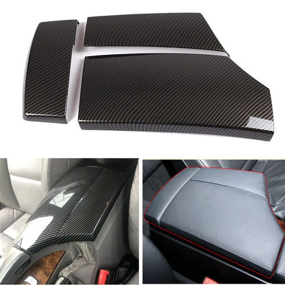 Set of three black ABS armrest box covers with a diagonal carbon fibre weave pattern and polished surface.