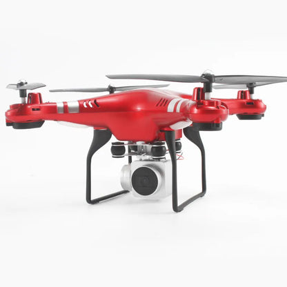 Alloy-built black HD aerial photography drone with remote control handle on grass