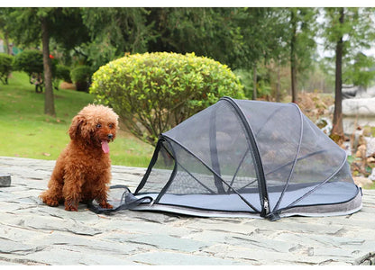 Black and blue half mesh portable folding tent for cats on a grey background.