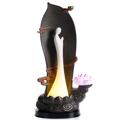 Purple clay tea pet ornament with downward flowing incense smoke and warm LED illumination