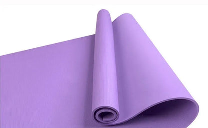 EVA composite fitness and yoga mat in blue, showing its texture and rolled edge next to a storage bag.