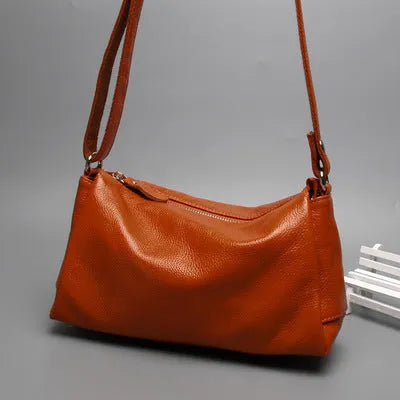 Soft genuine cowhide leather women's crossbody bag in horizontal square shape on a single strap.