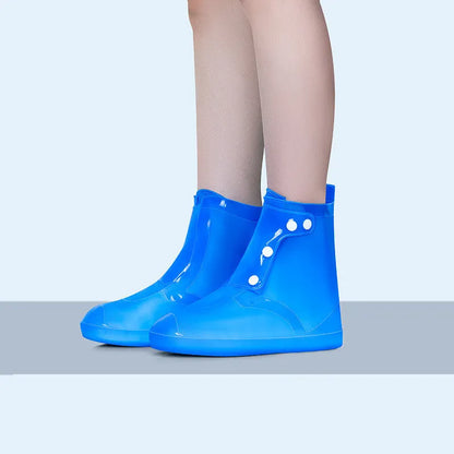 White high-top PVC waterproof shoe cover for women, shown on a foot.