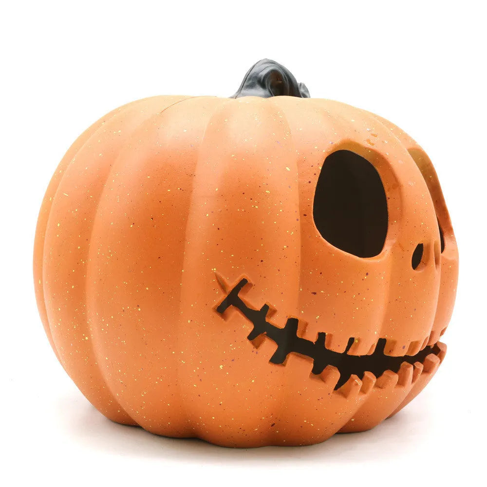 Yellow Halloween pumpkin lantern with hollow-out skull hooded design, resin prop measuring 23 x 19cm