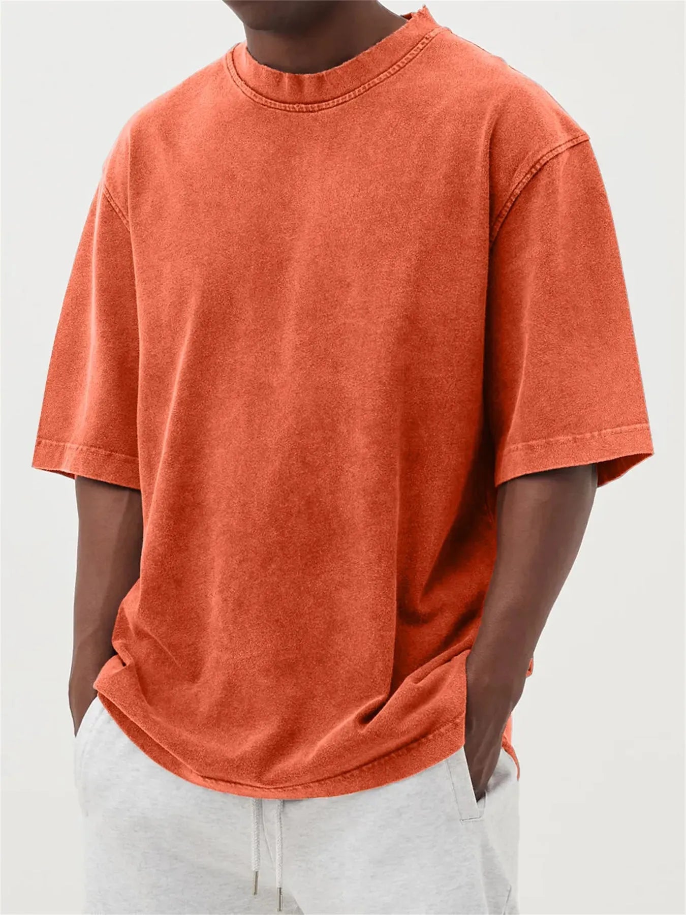 Men's loose fit stone-washed distressed short sleeve t-shirt in solid colour