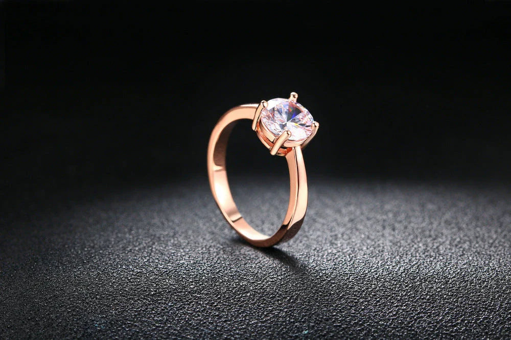 Close-up of a beautiful rose gold ring with sparkling zircon stones