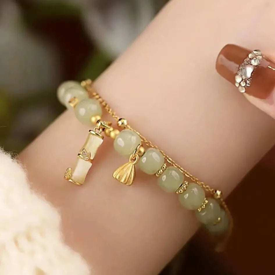 Retro bamboo design bracelet with floral shape and ruyi element in glass and coloured glaze