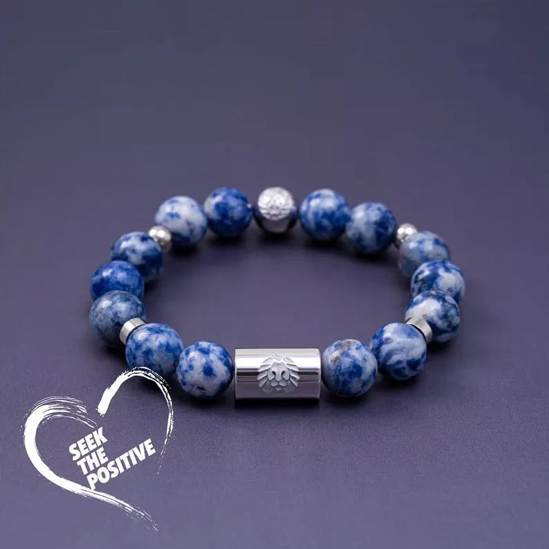 Little Lion ethnic geometric bracelet made from brown Bodhi seed beads on a wrist.