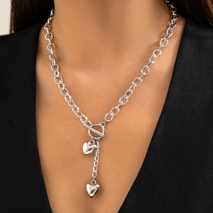 Elegant chain necklace and bracelet set with shiny lock and key pendant, fashionable ladies accessories