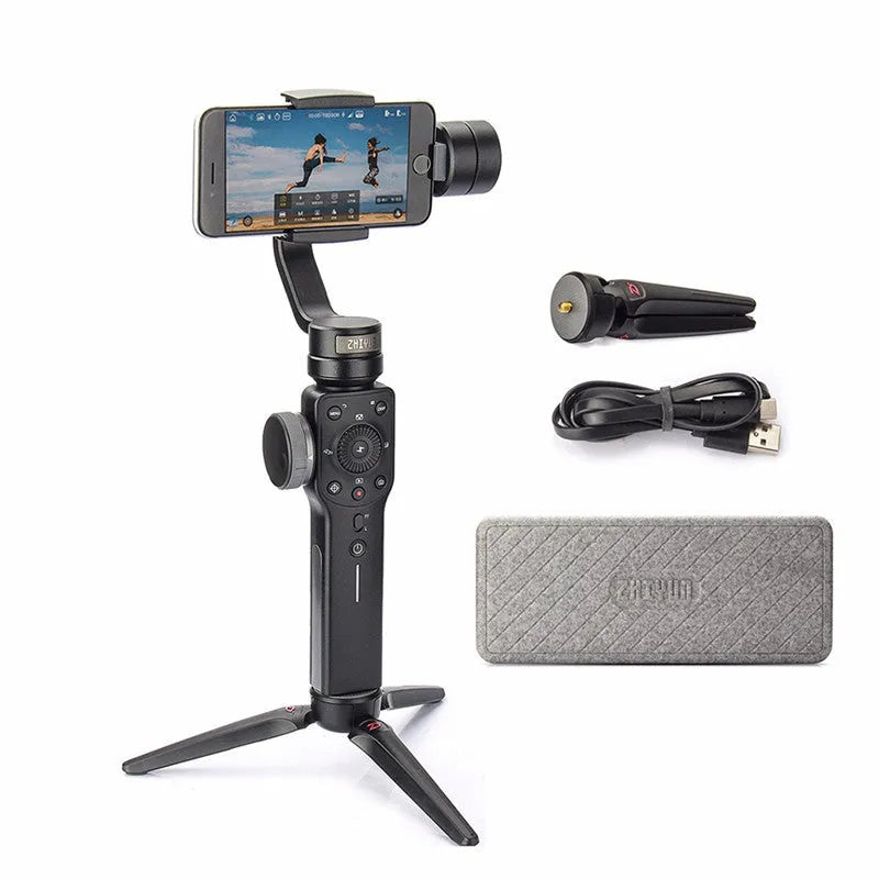 Black mobile phone handheld stabiliser gimbal on table with smartphone mounted