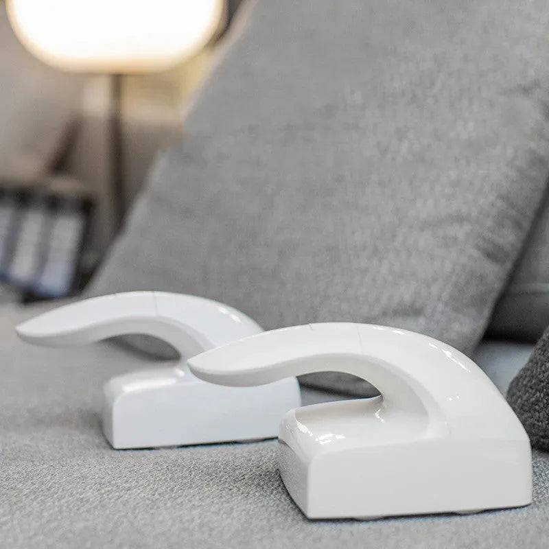 White ABS plastic reusable pet hair remover roller for cat and dog fur on fabrics.