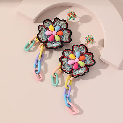 Handmade bohemian shell tassel earrings for women with colourful flower and geometric drop design