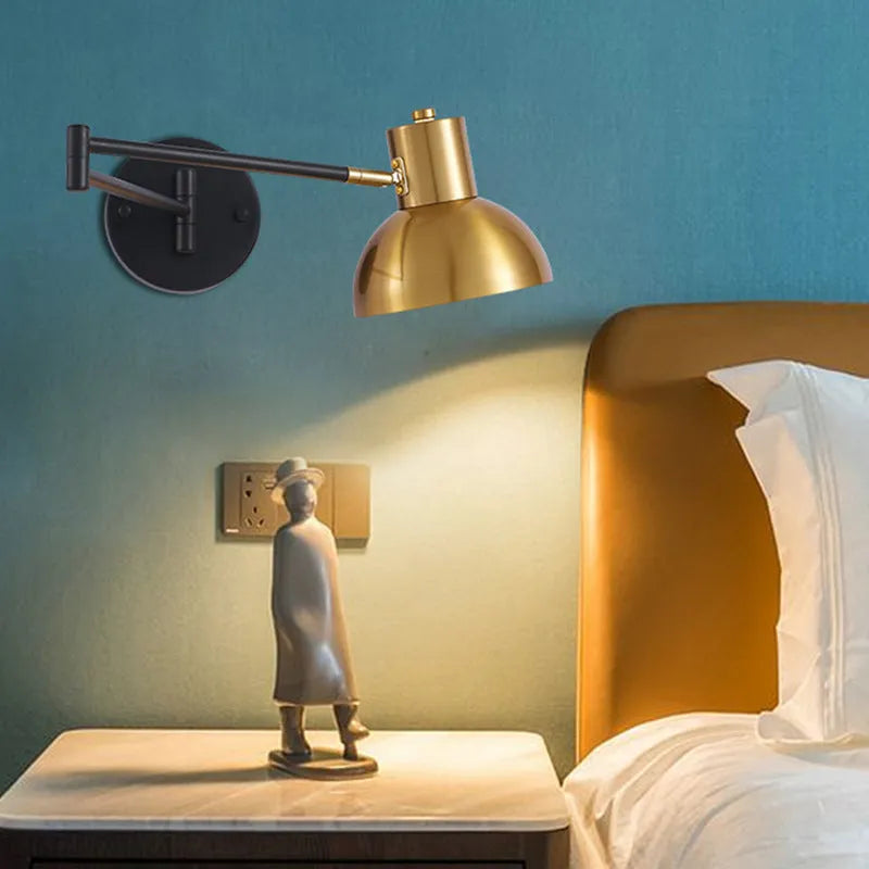 Modern minimalist double-section metal rocker arm wall lamp extending from a wall, showing its adjustable joints.