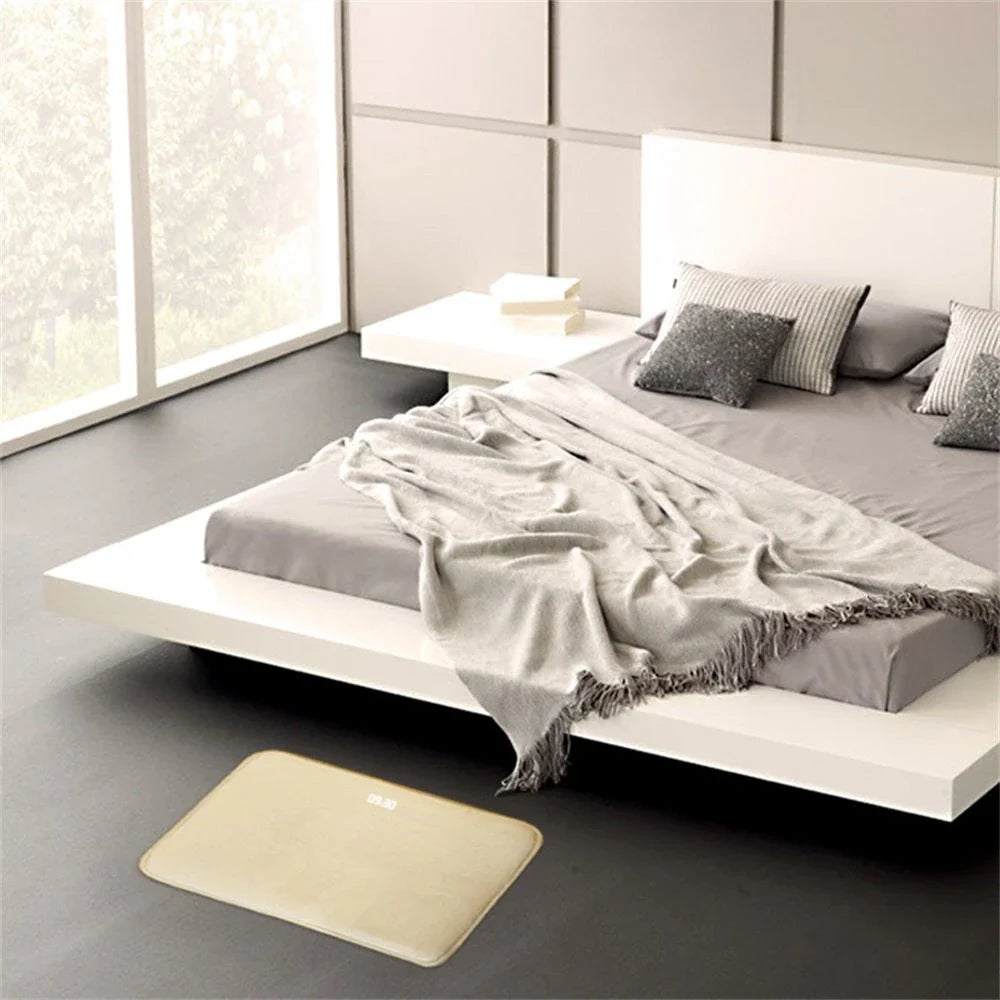 Smart pressure-sensitive alarm clock with LED display and memory foam base for comfortable, refreshing mornings