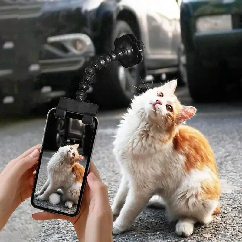 Black pet photography tool with rotating clip and phone holder for attracting pet attention during photos