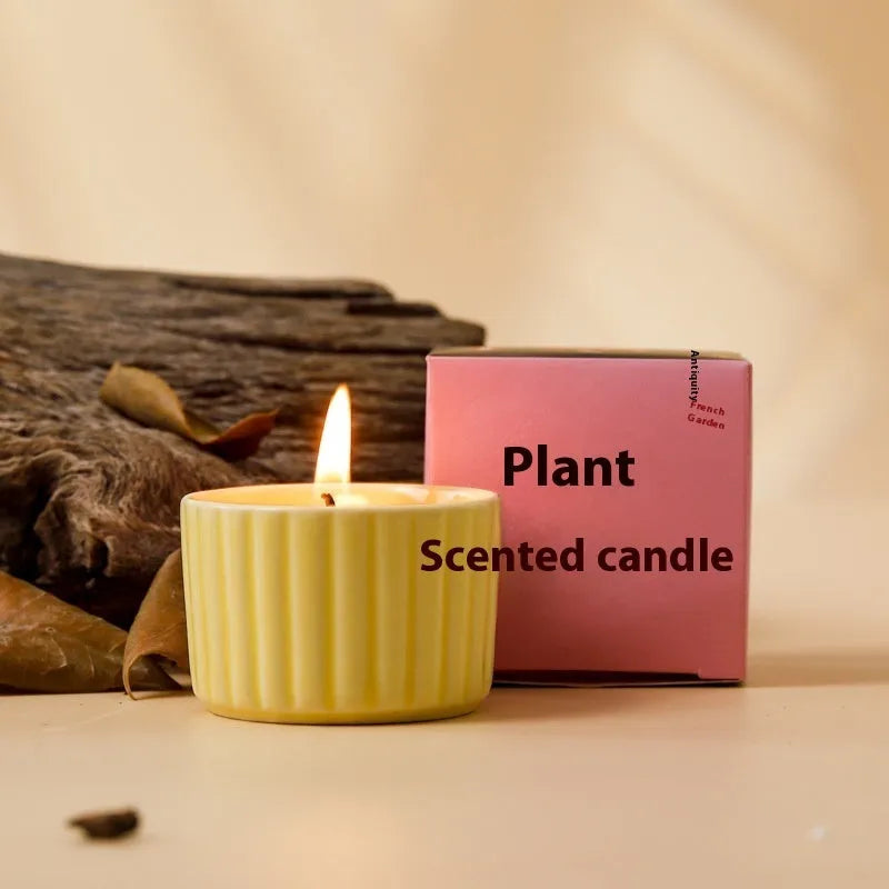 Soy wax aromatherapy candle inside a handmade ceramic cup, shown in a mint green colour.