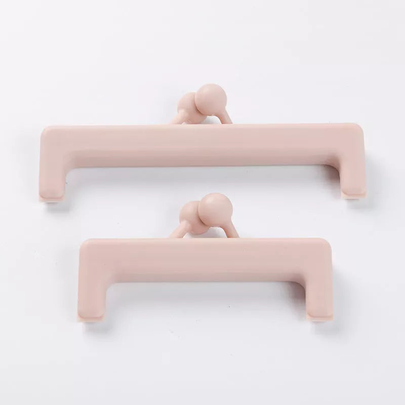 Push-button plain food bag sealing clip in blue and pink, sizes large and small