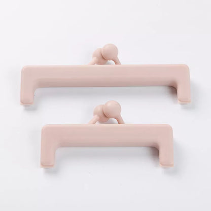 Push-button plain food bag sealing clip in blue and pink, sizes large and small