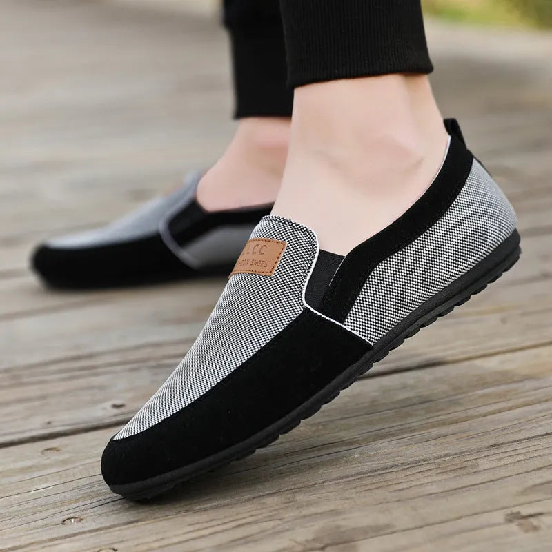Men's grey canvas lace-up casual shoes with a round toe and rubber sole.