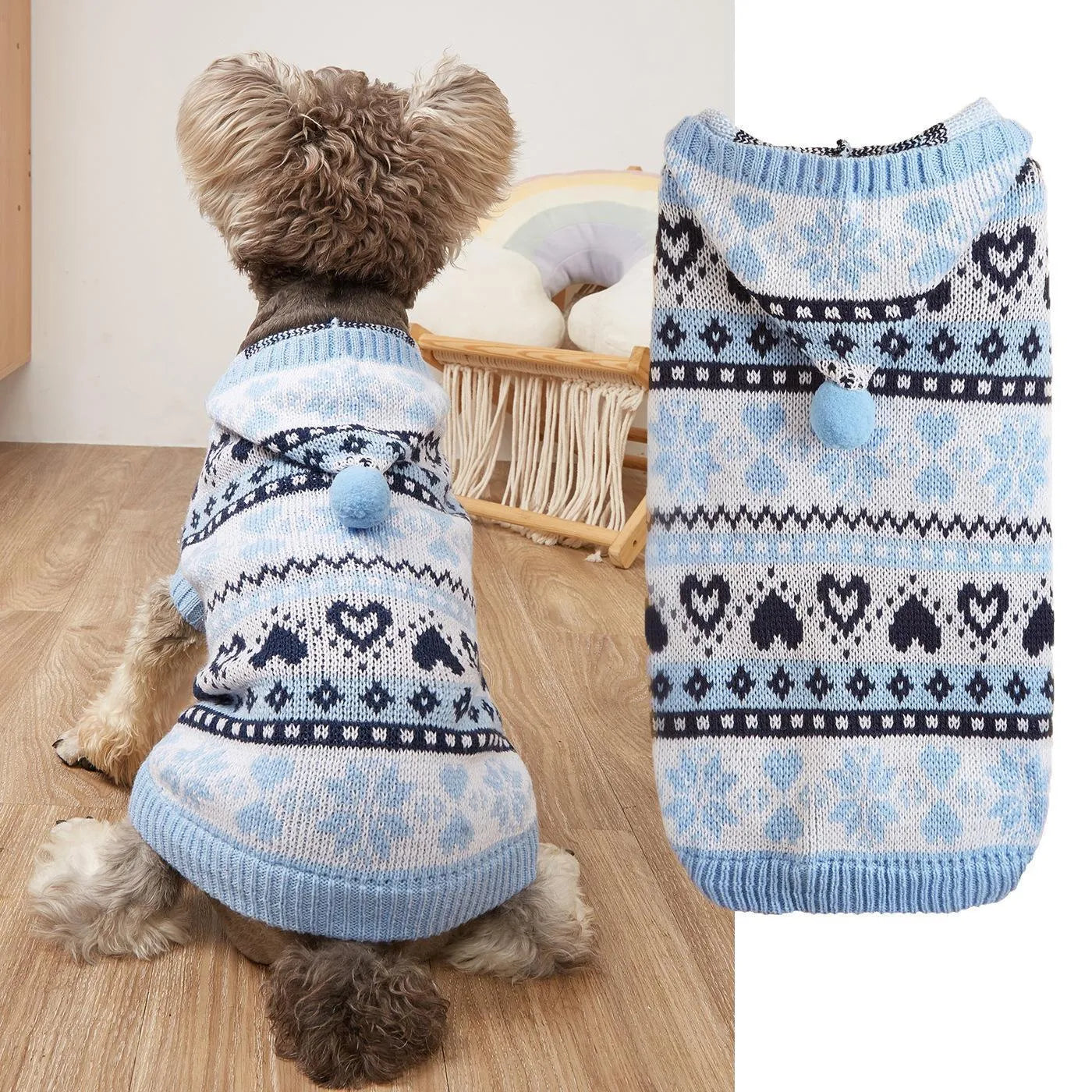 Small dog wearing a pink camouflage patterned knitted sweater with snowflake and heart stripes.