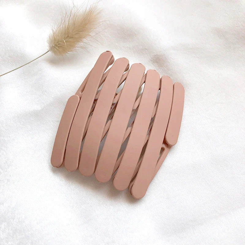 Compact retractable hair band with non-slip teeth grip, available in various colors for versatile styling