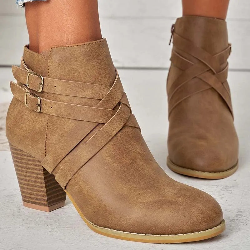 Women's short ankle boots with a belt buckle and side zip in black, brown, or grey with a 7cm heel.