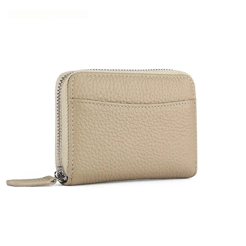 Genuine leather zipper coin purse in a solid colour showing sewing line detail.