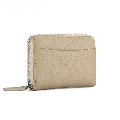 Genuine leather zipper coin purse in a solid colour showing sewing line detail.