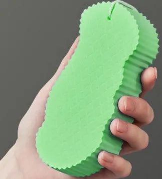 3D fish scale pattern bath sponge in white, grey, pink, or light blue for gentle exfoliation