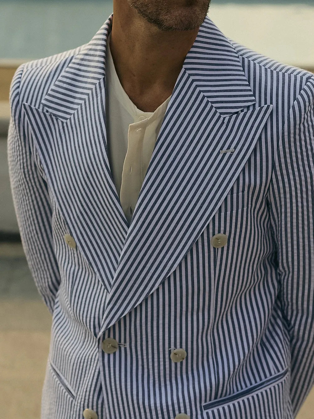 Blue and white striped two-piece suit set with matching blazer and trousers