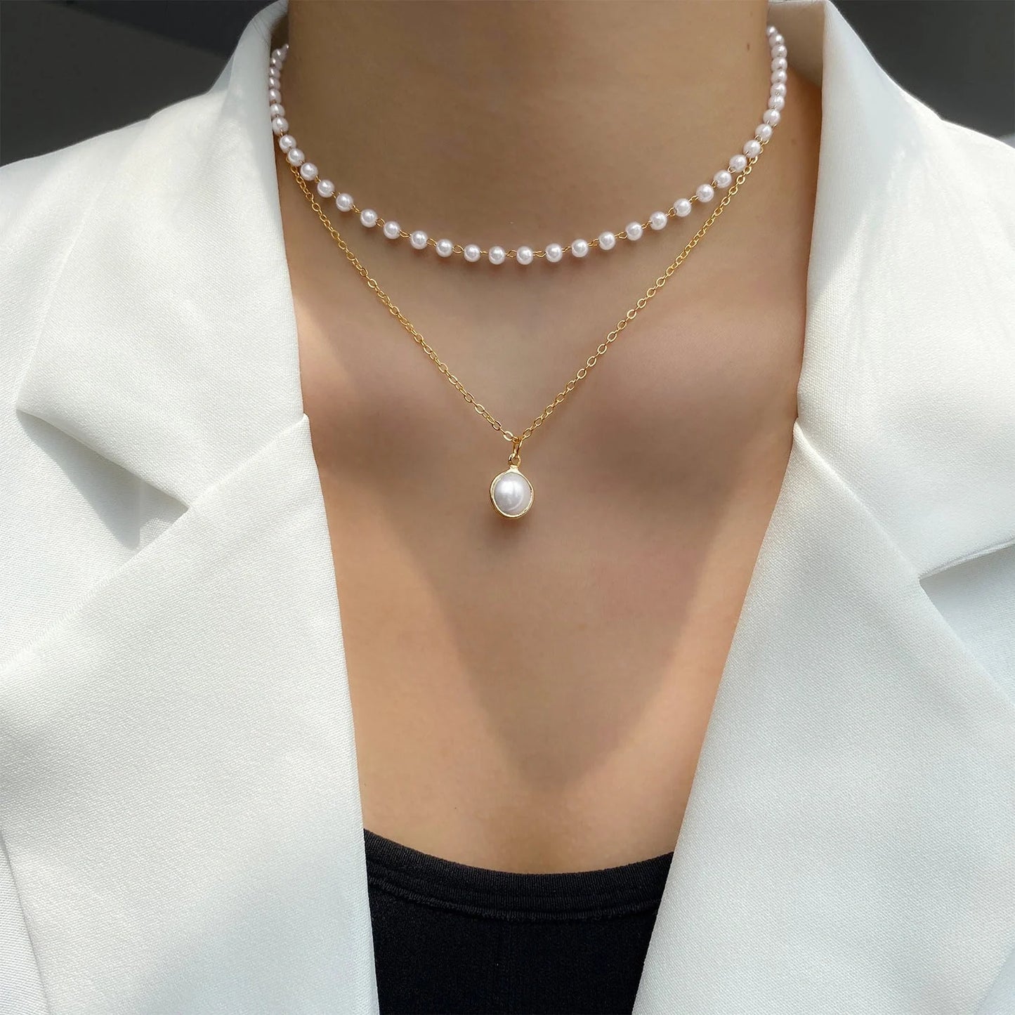 Elegant gold pearl tassel necklace with double-layered design and adjustable chain