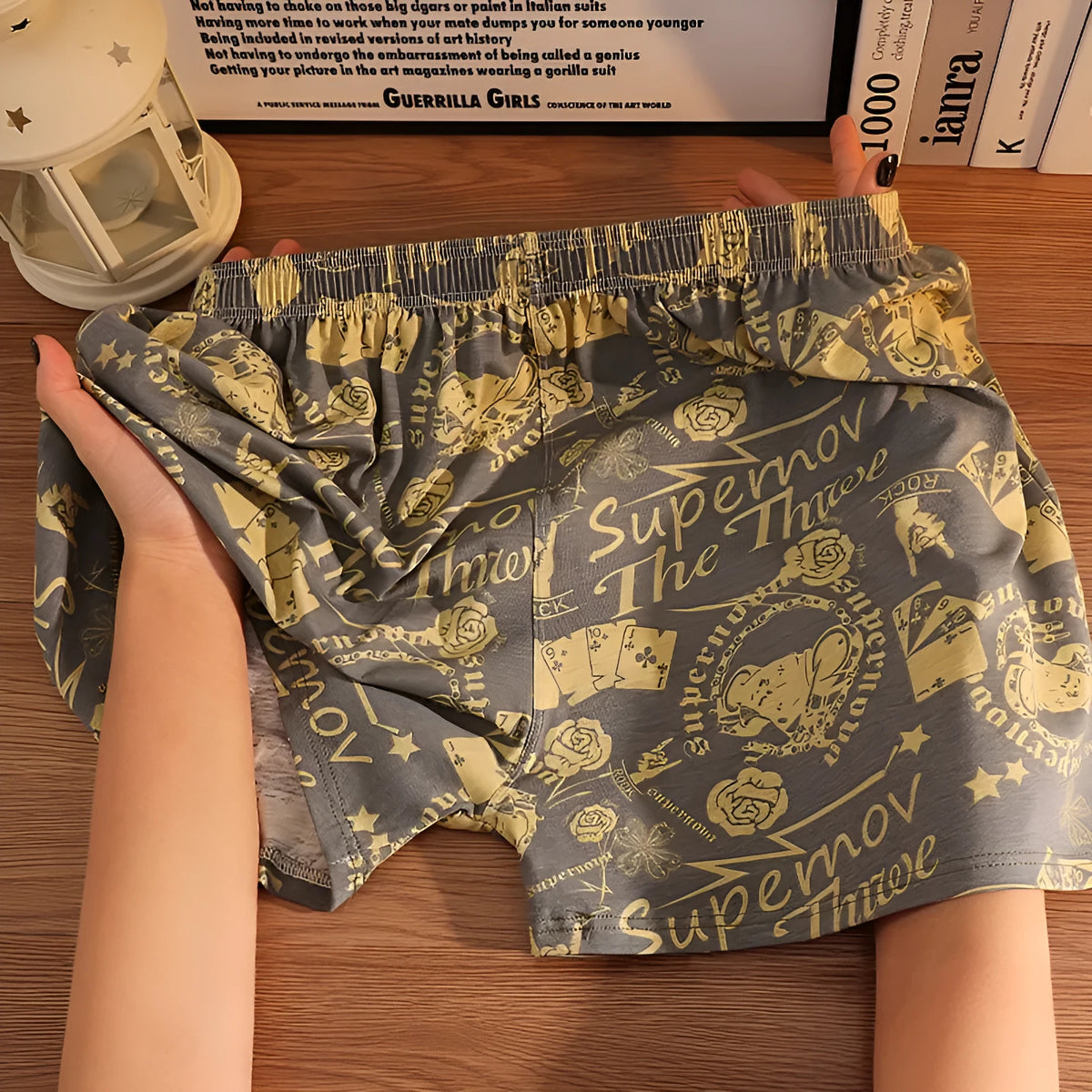 Men's loose fit cotton printed boxer shorts in a grey and blue pattern on a mid waist design.