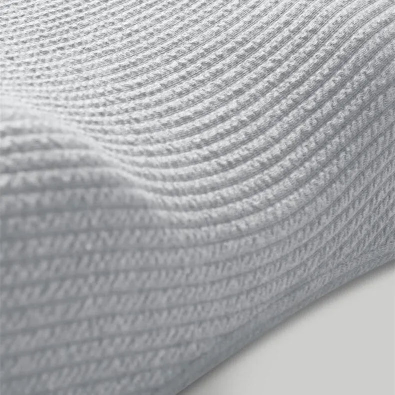 Grey memory foam neck support pillow with knitted cotton cover and adjustable inserts