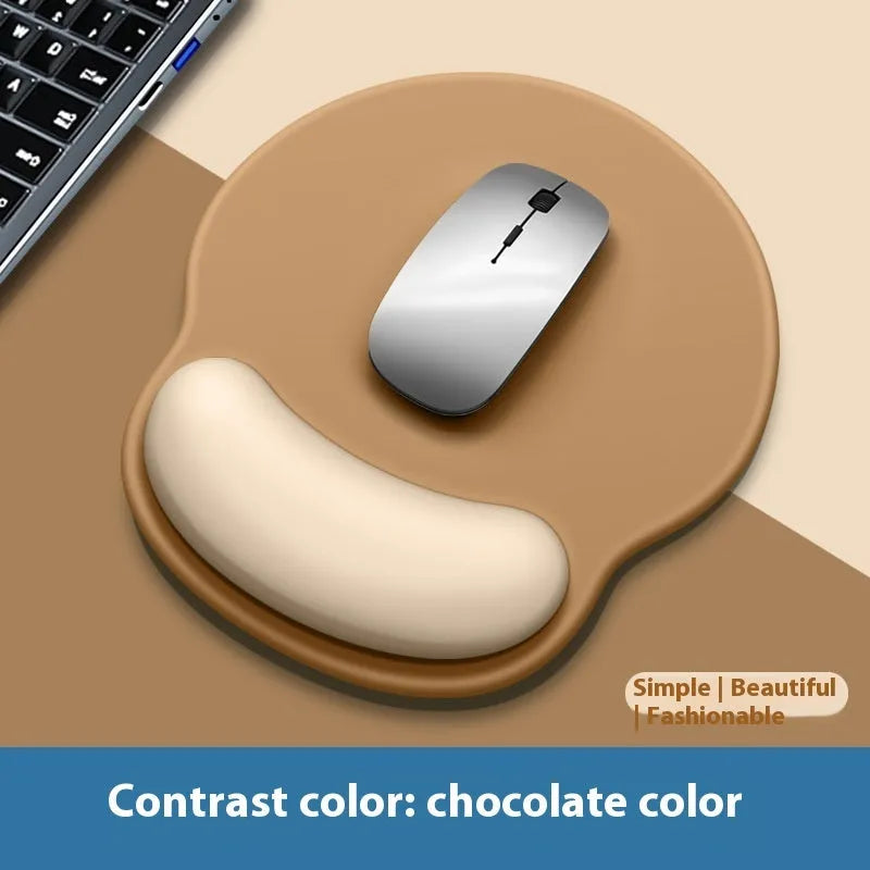 Silicone mouse mat with integrated wrist rest in a gradient blue black colour on a desk.
