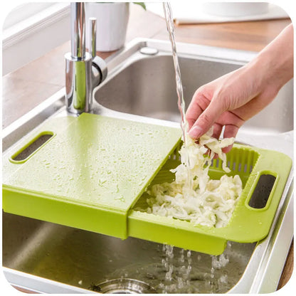 Blue multifunction kitchen chopping board with integrated sink drain basket and TPE handle.