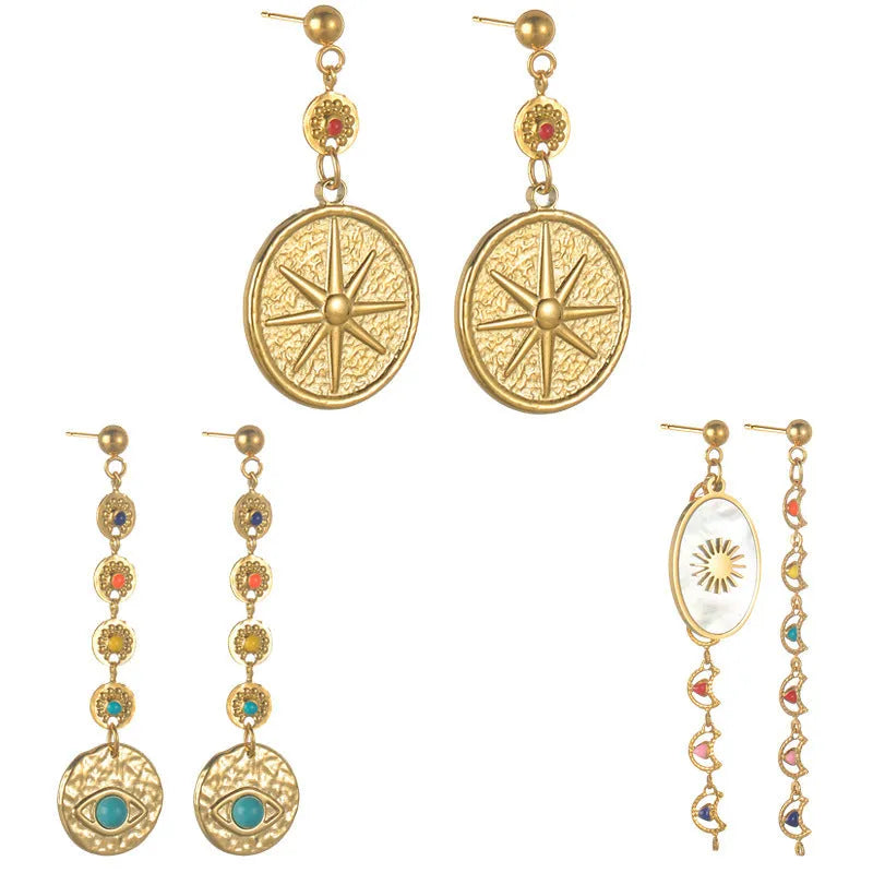 Geometric stainless steel earrings showing Eight Awn Star, Eye and Shell Sun designs