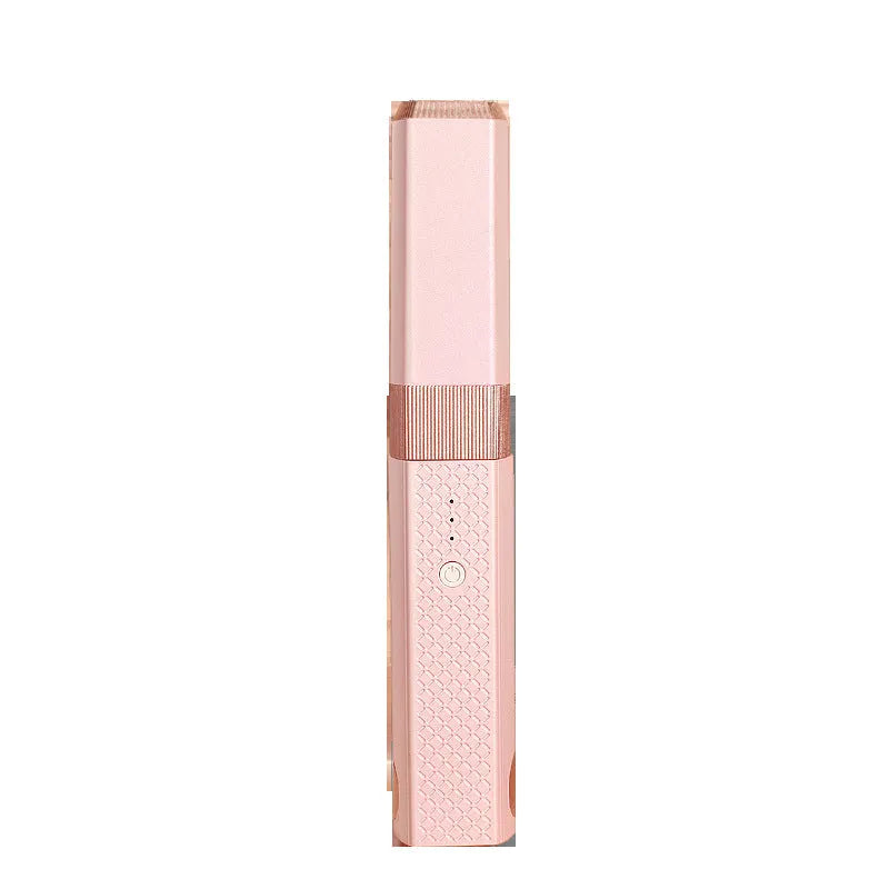 Pink and green cordless mini USB hair straightener and curler with ceramic plates.